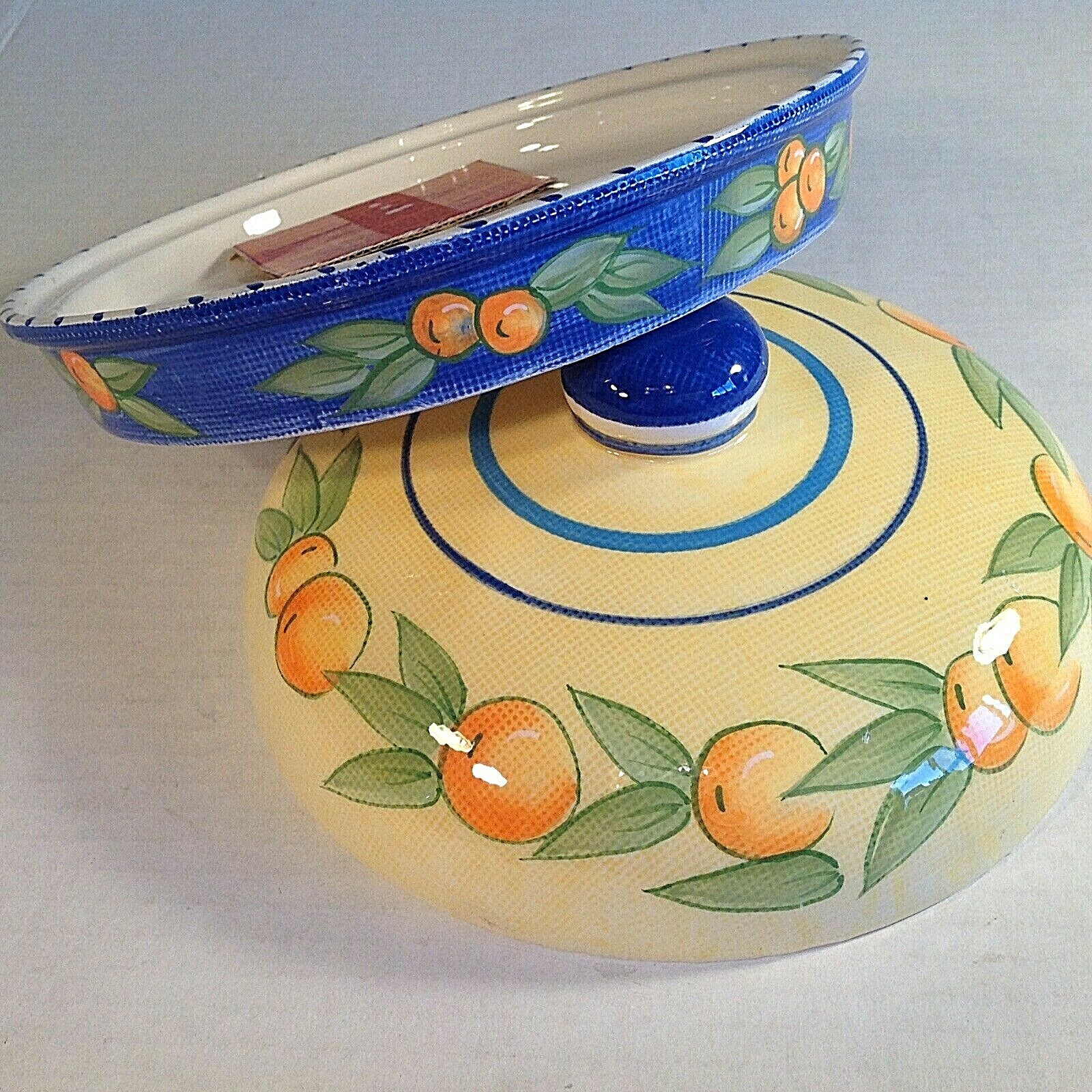 Boston Warehouse Trading Corp. Garlic Baker  4 X 7.5 Inches. Oranges