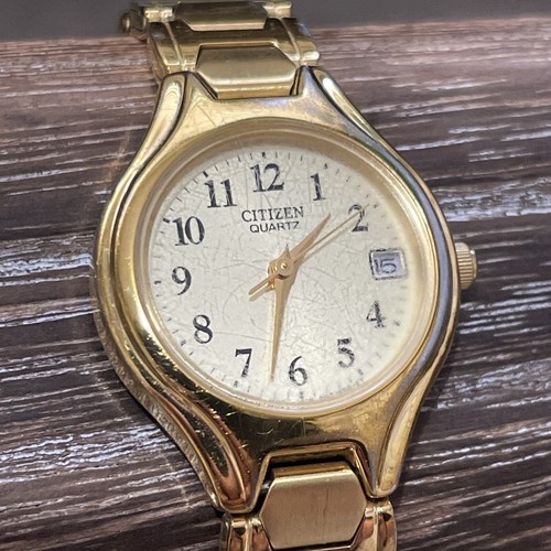 Citizen Gold-Tone Champagne Dial Date Ladies Quartz Watch