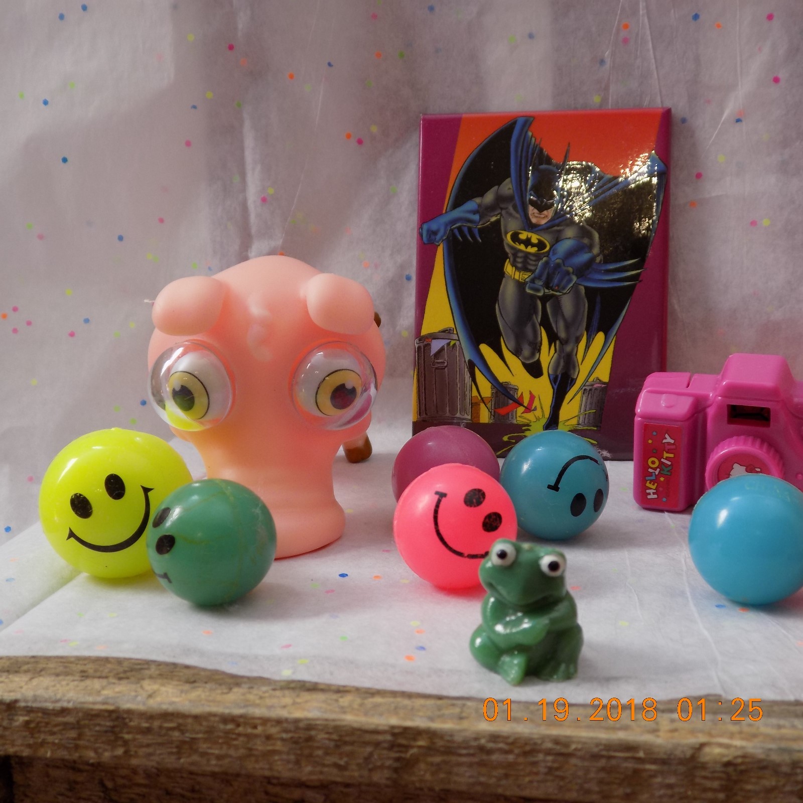 lot of mixed toys stress pig,hello kitty camera,happy face bounce balls,animal