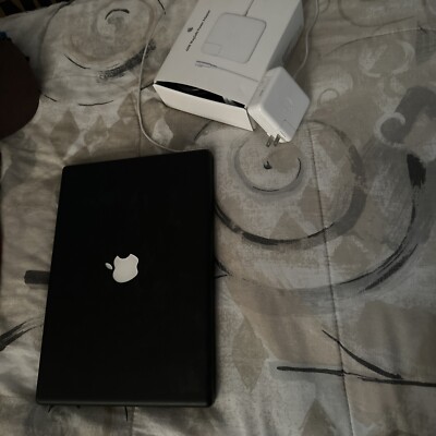 Apple MacBook A1181 13.3'' Laptop - (needs new battery, still runs while plugged)