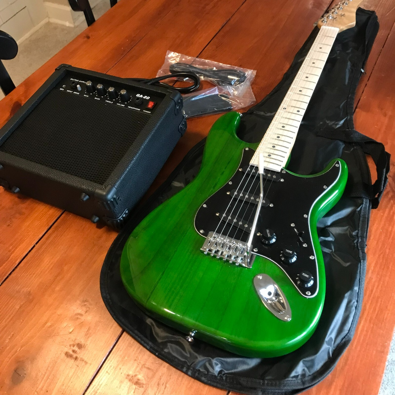Full-Size Green Electric Guitar Starter Package with 20-Watt Amp and Accessories