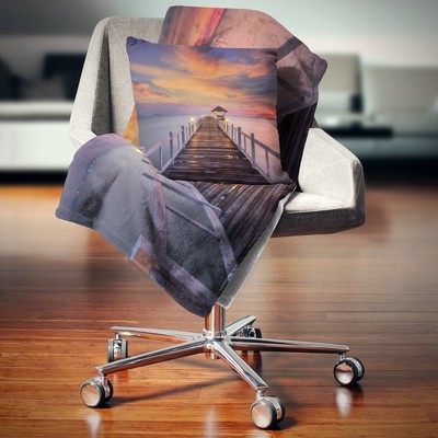 Designart 'Dark Seashore Pier under Colorful Sky' Pier Orange 71 in. x 59 in.
