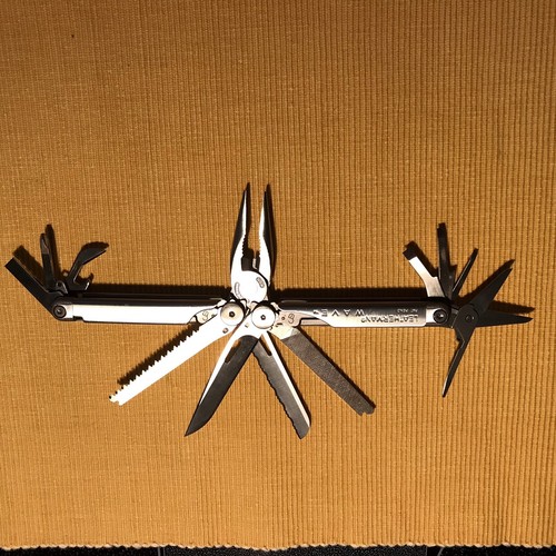 New, Pre-Owned, Retired Original 1999 Leatherman Wave with Leather Sheath