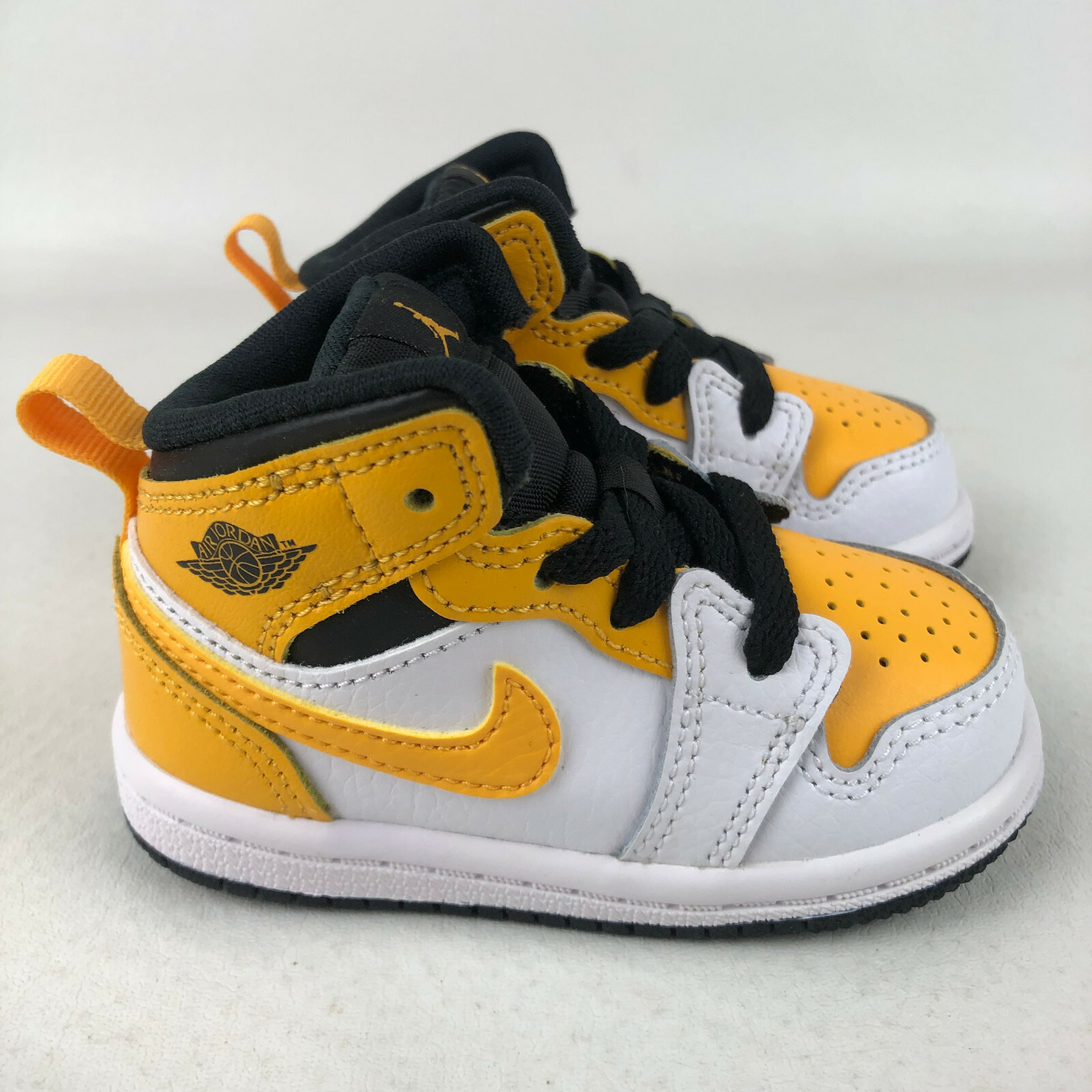 nike mid university gold