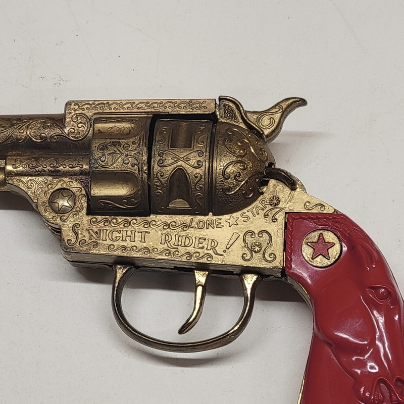 Very Rare Lone Star Night Rider Cap Gun In Gold With Red
