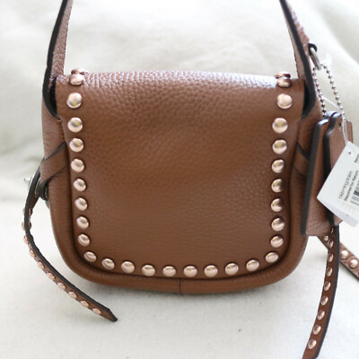 NWT COACH Saddle Rivet Stud Pebbled Leather Dakotah Mini Crossbody Swing Bag NEW NWT COACH Saddle Rivet Stud Pebbled Leather Dakotah Mini Crossbody Swing Bag NEW