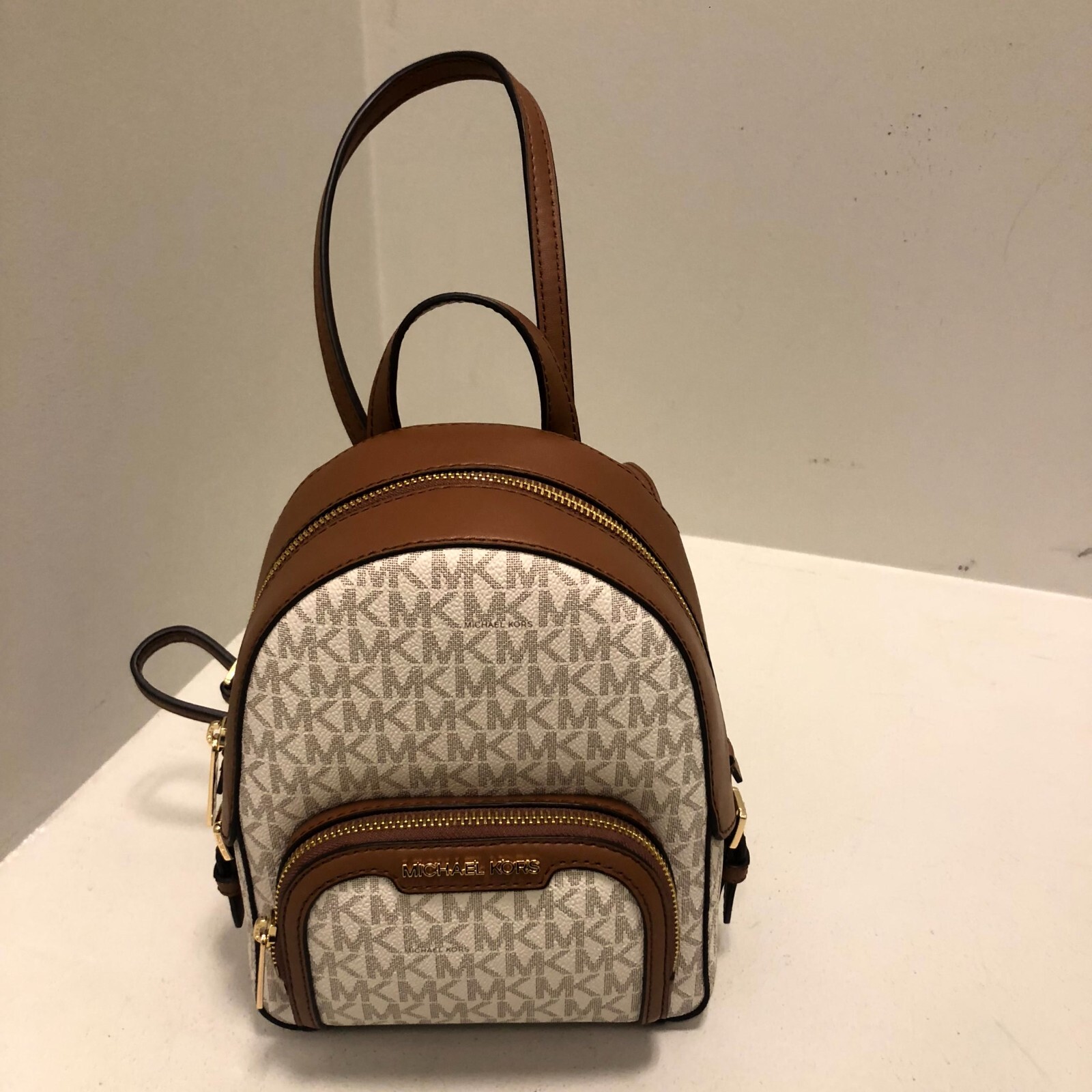 Michael Kors Jaycee Signature MK Logo XS Convertible Zip PKT Backpack Vanilla