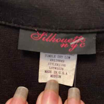 Black Jacket with longer tail in back in medium