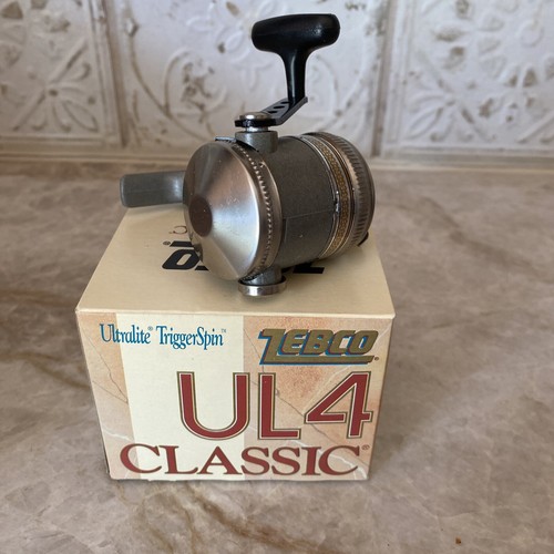 Zebco UL4 Classic Fishing Reel Trigger Spin Feather Touch NIB