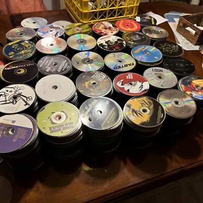 LOT OF 500 Random DVDs & CDs. NO CASES. MAY OR MAY NOT Work. No Return.