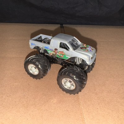 Vintage MUSCLE MACHINES THE WOLFMAN MONSTER TRUCK Silver 1:64 Scale Metal