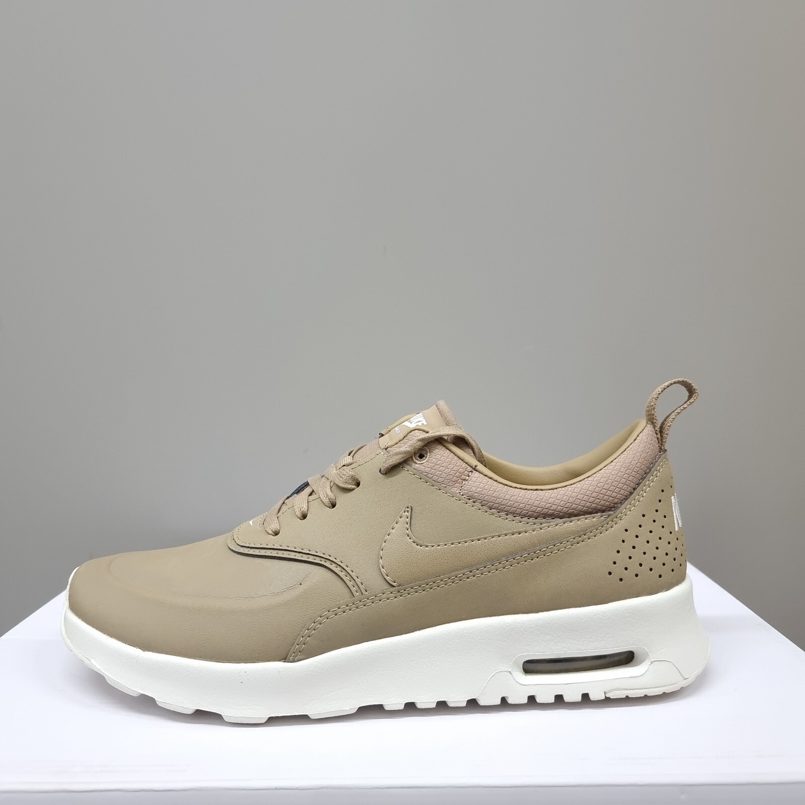 white & gold air max thea trainers