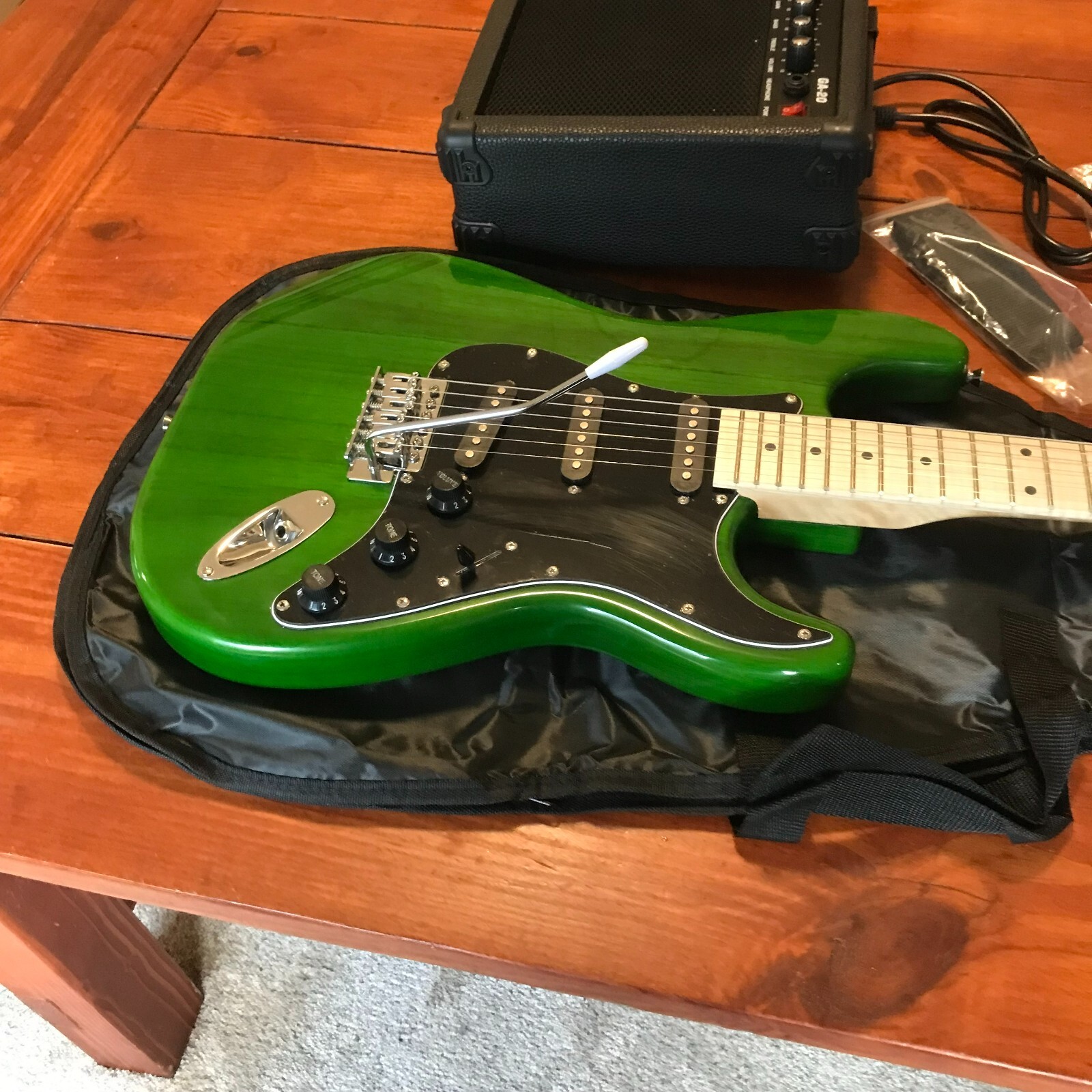 Full-Size Green Electric Guitar Starter Package with 20-Watt Amp and Accessories
