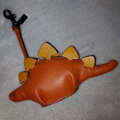 coach purse with dinosaurs