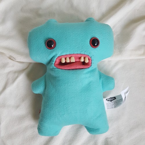 Fuggler ugly weird cute stuffed animal turquoise blue fabric with plastic teeth