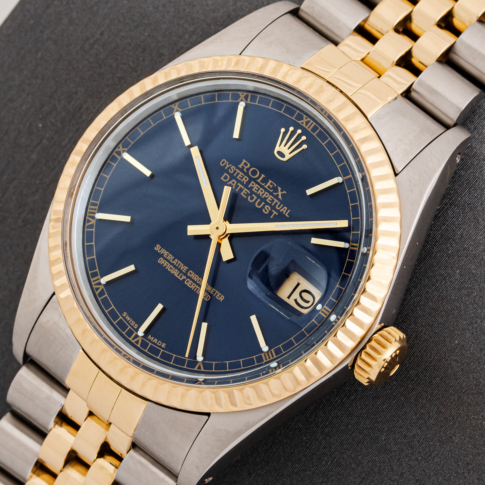 Rolex Mens Datejust Steel and 18K Yellow Gold Blue Index Dial Fluted Bezel Watch