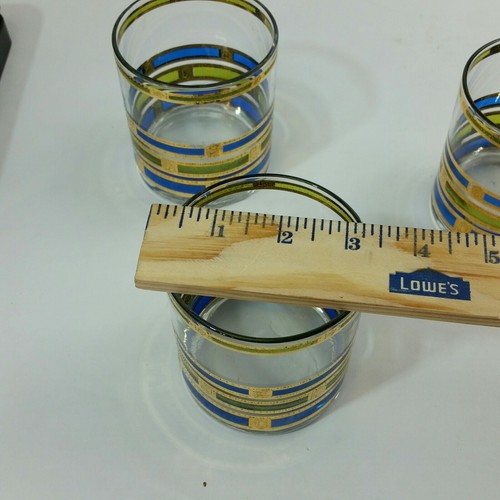 4 VINTAGE MID CENTURY BARWARE  gold blue and green colors