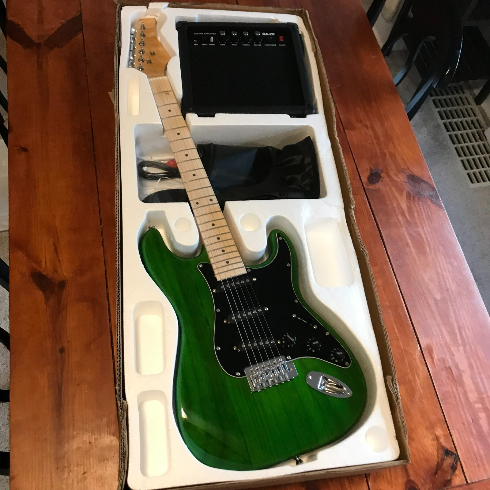 Full-Size Green Electric Guitar Starter Package with 20-Watt Amp and Accessories