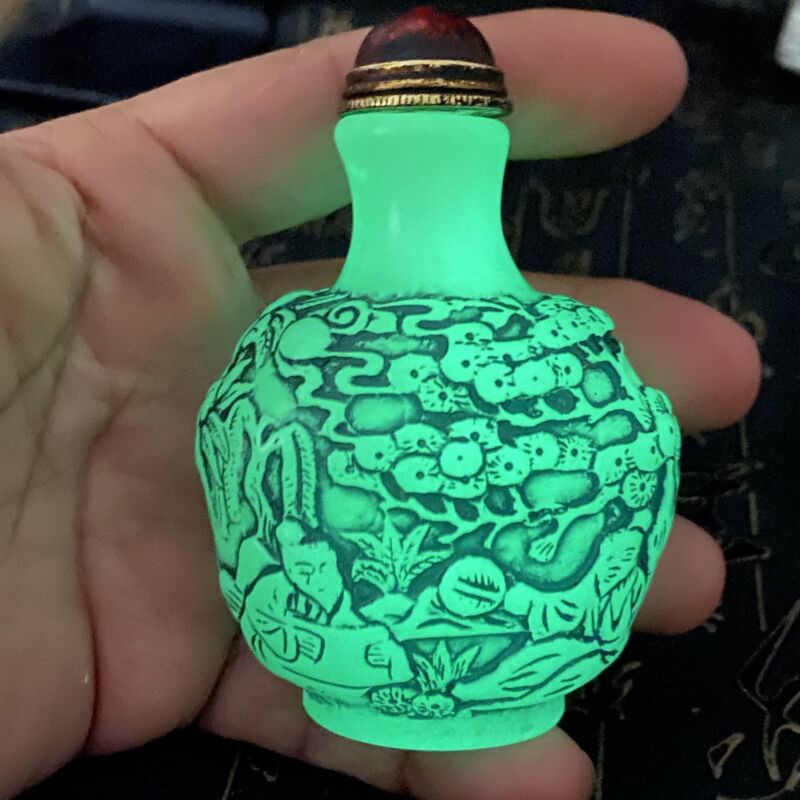 A luminous snuff bottle beautifully carved by hand in ancient China