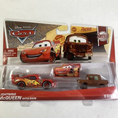 Disney Pixar Cars Lightning McQueen with Sign and Fred Rust-Eze 2012 NEW