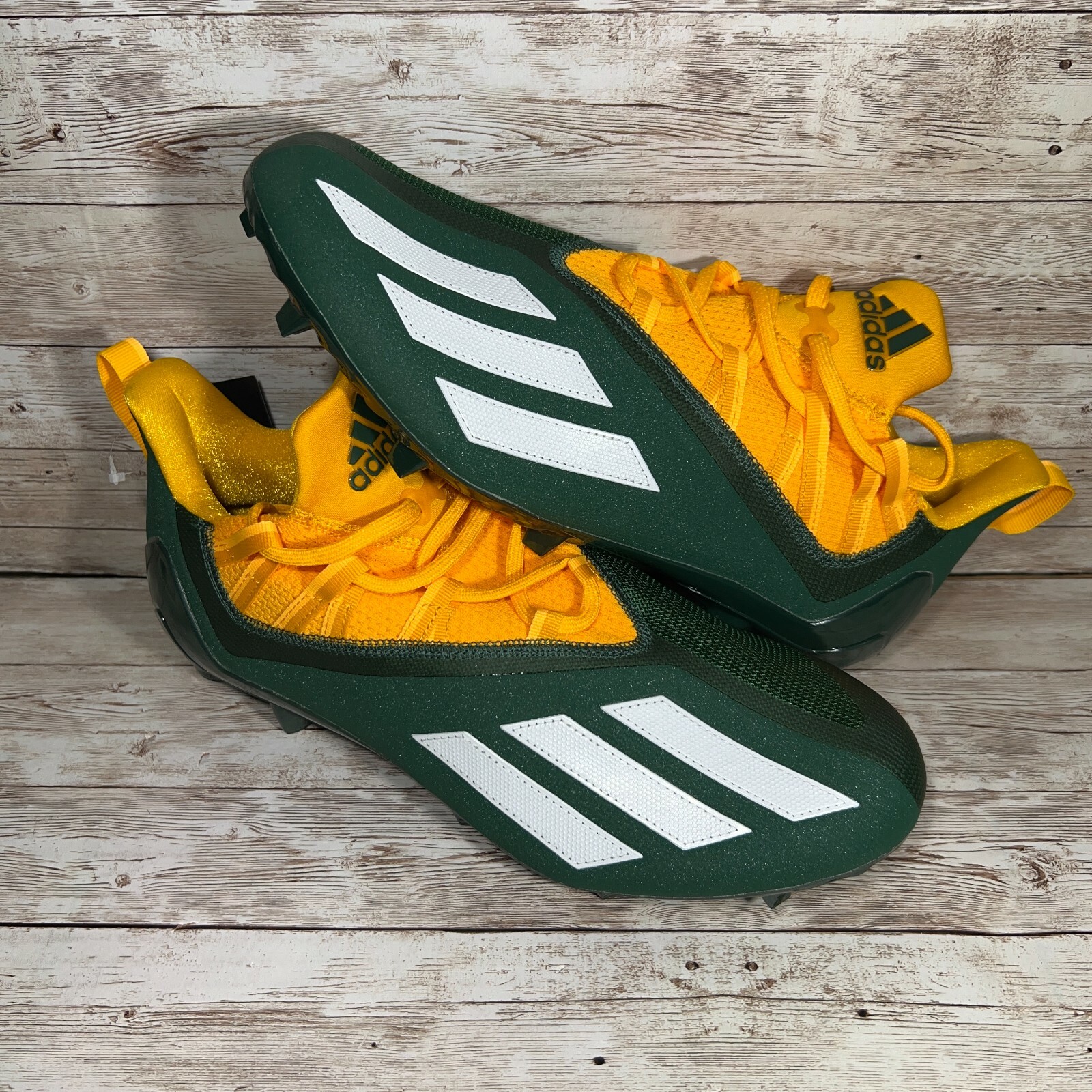 green and yellow football cleats