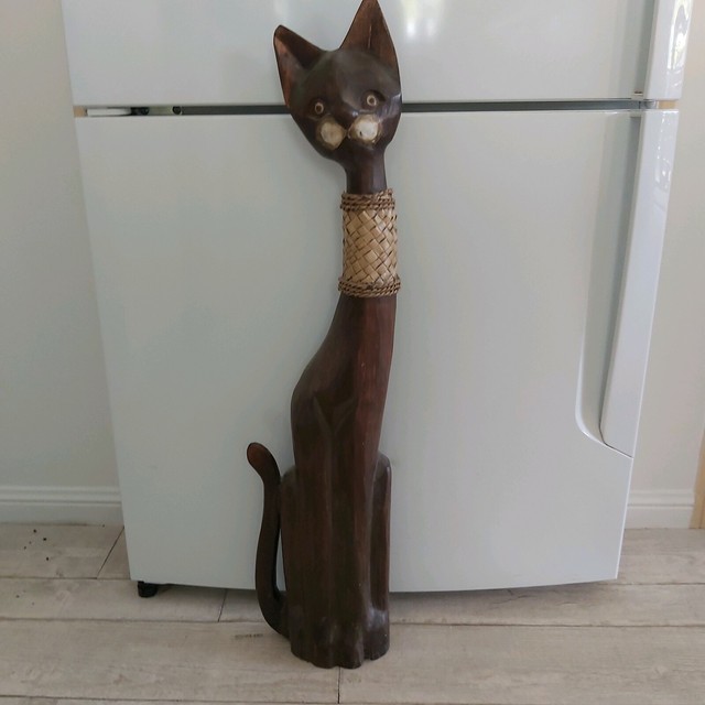 tall wooden carved cats