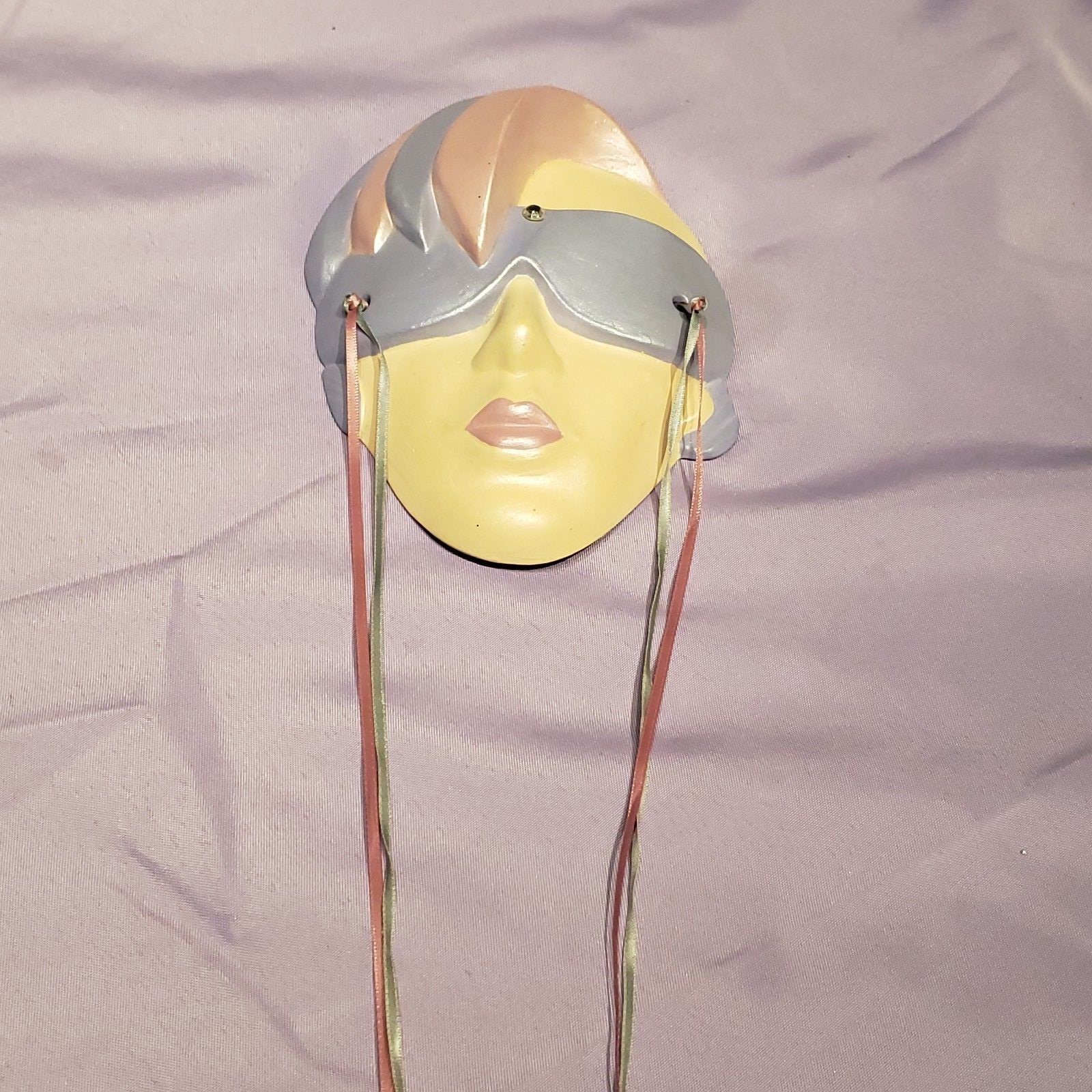 wall decor mask face purple pink cream