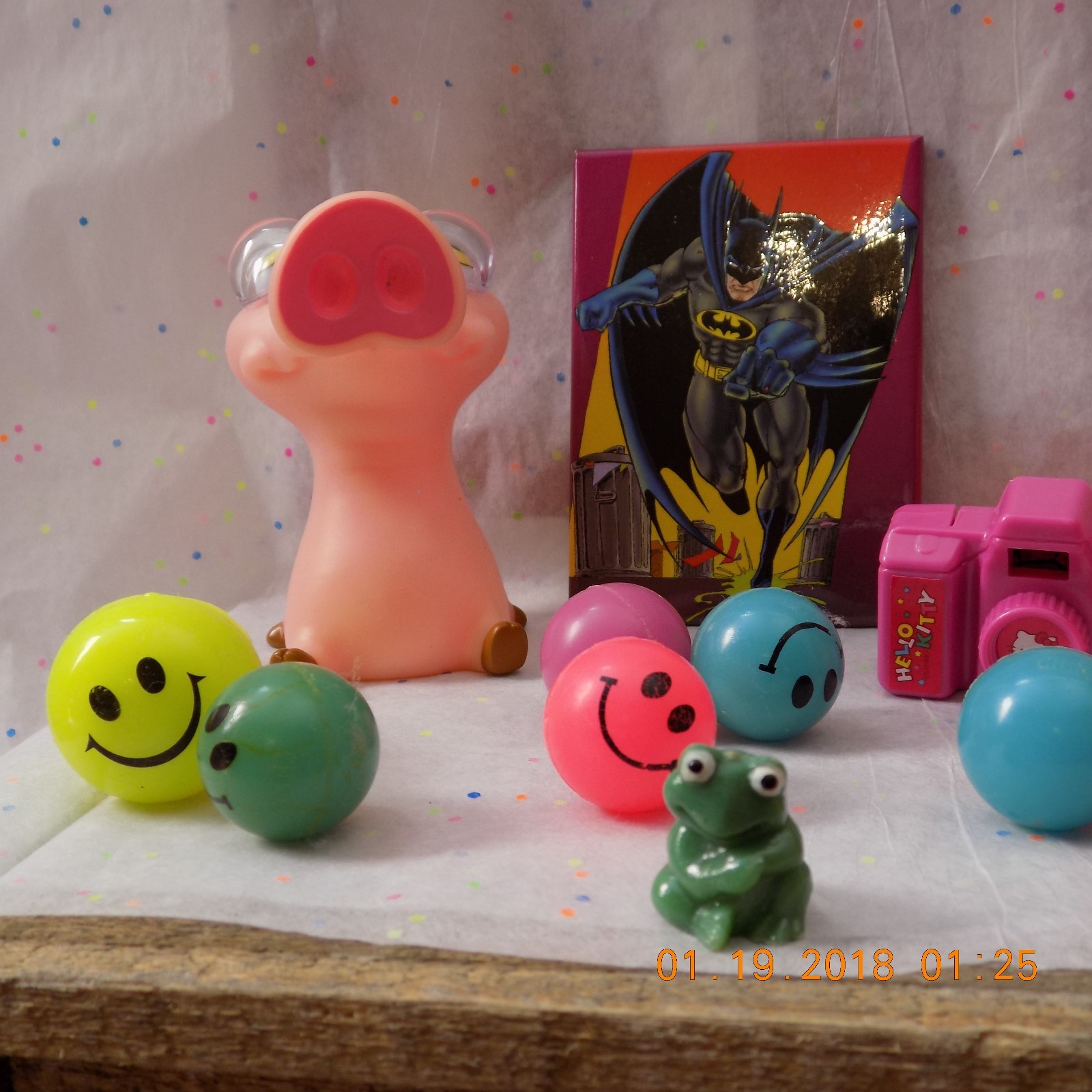 lot of mixed toys stress pig,hello kitty camera,happy face bounce balls,animal