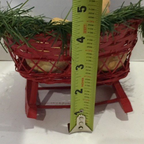 Two Ceramic Pigs in a Wooden Christmas Sled Decor