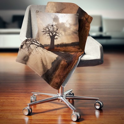 Designart 'Large Baobab Tree under Clouds' Modern Landscape Brown 71 in. x 59 in