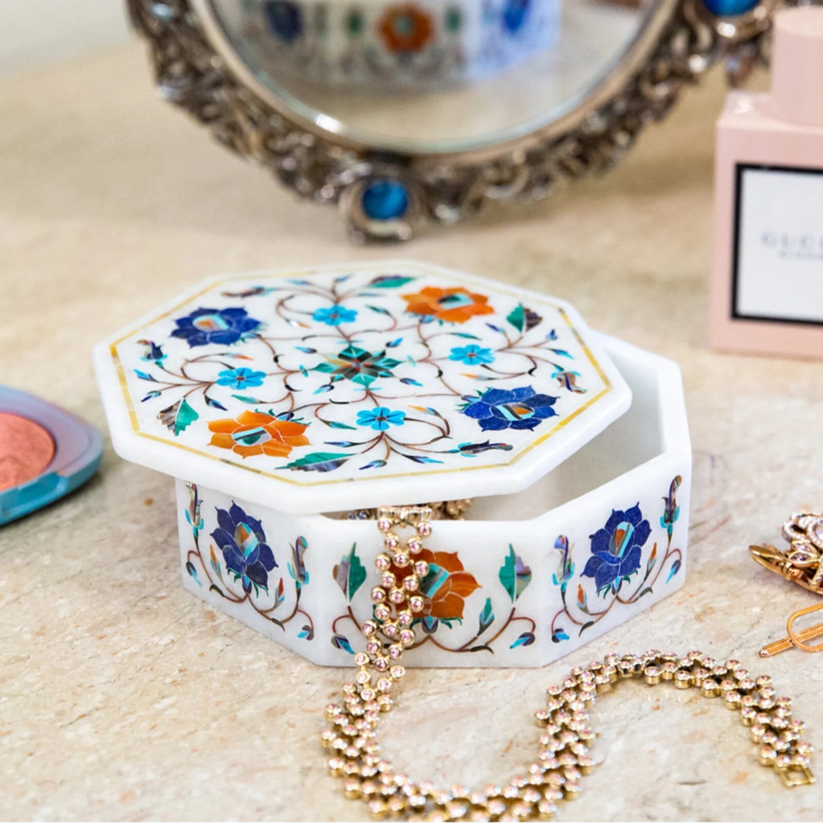 Decorative white marble box inlaid with flowers, hexagon