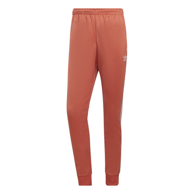 Adidas sst hotsell track pants orange