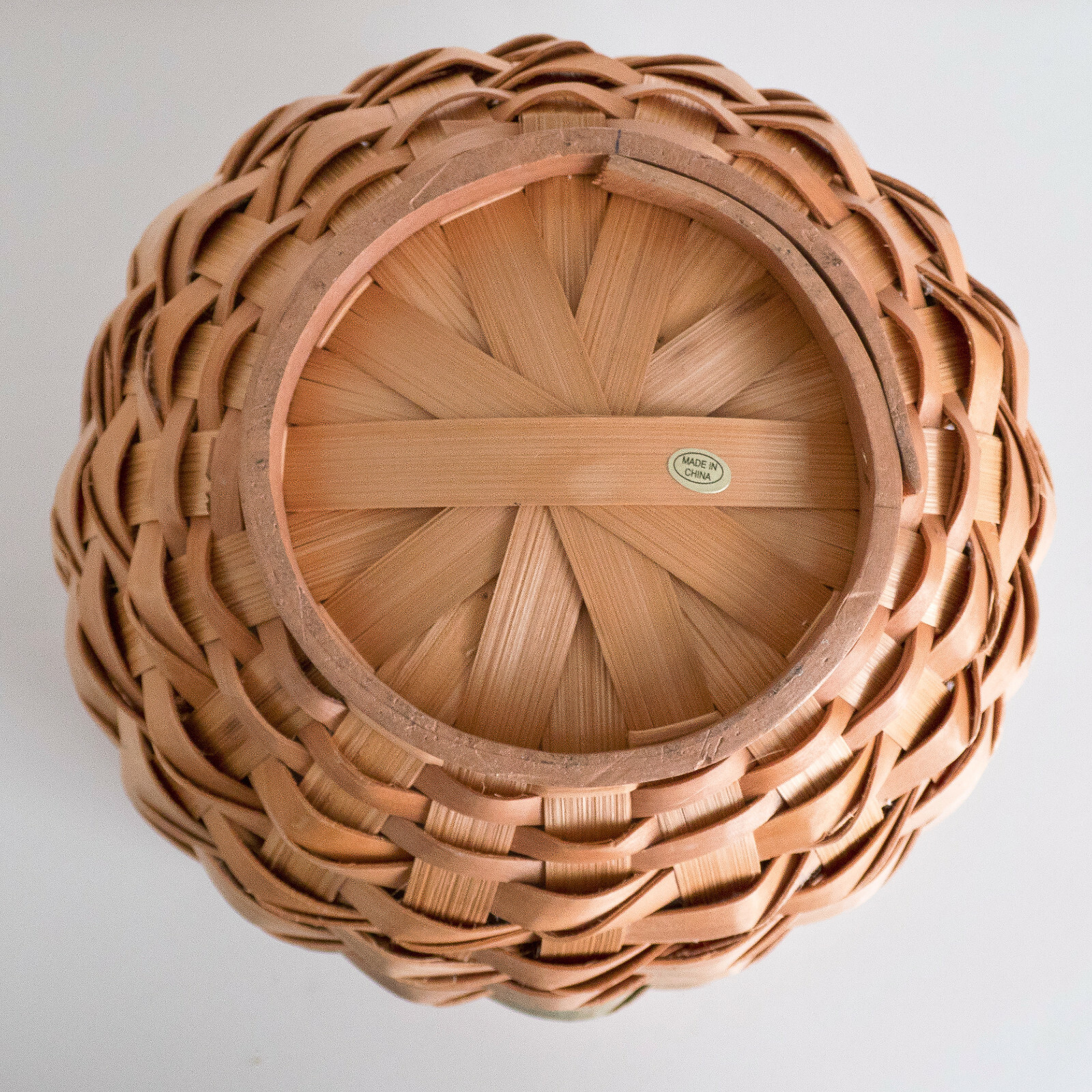 Tan Woven Wicker Circular Basket with Green Bands