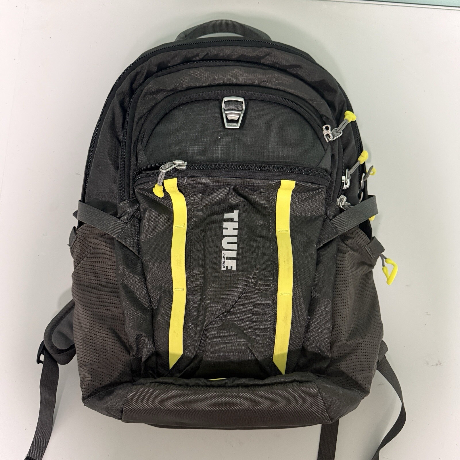 Angled front view with bag zipped and handles upright.