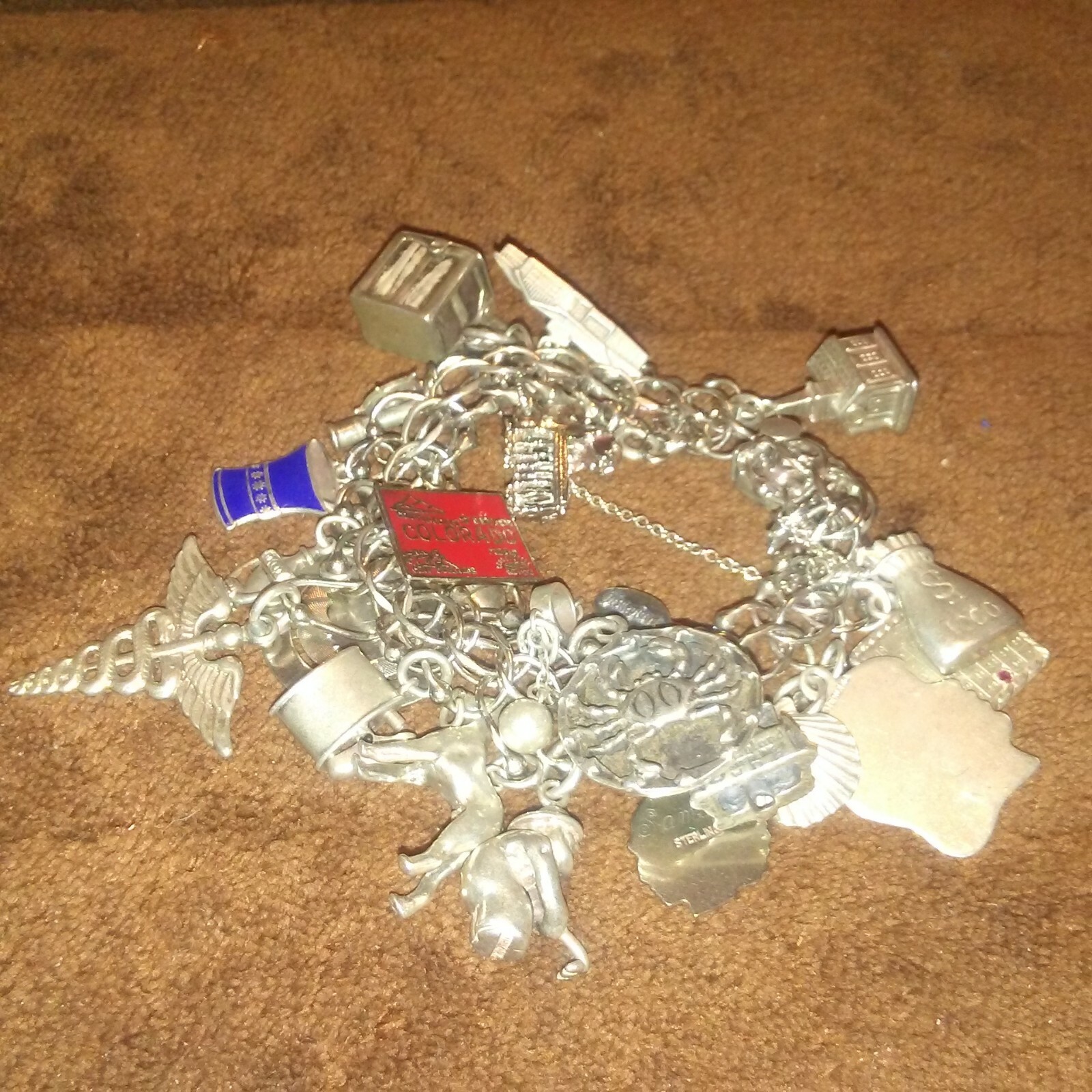 Vintage Sterling Silver Charm Bracelet with 24 Charms 86.6 grams 1960's