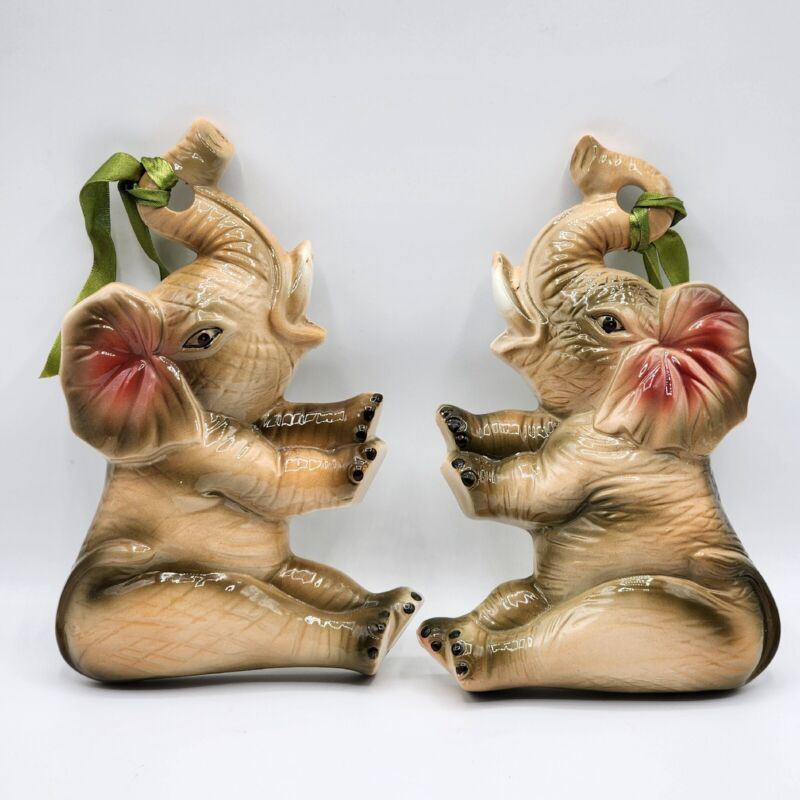 Set of Two Porcelain Wall Plaques Sitting Elephants with Trunks Up