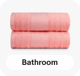 Two pink bath towels linking to bathroom essentials page