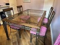 Classic and unique glass topped dining table and 4 chairs