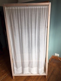 Ikea Wardrobe With Plastic Panels And Fabric Curtain In