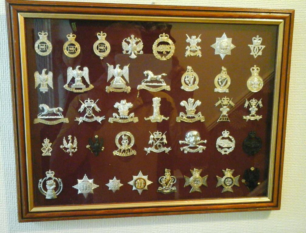 Framed collection of British army cap