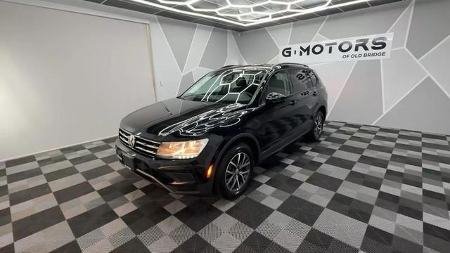 2021 Volkswagen Tiguan, Black with 48111 Miles available now!