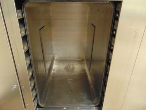 Getinge 6910 Autoclave with Pass Through Doors and 2 Stainless Steel Carts