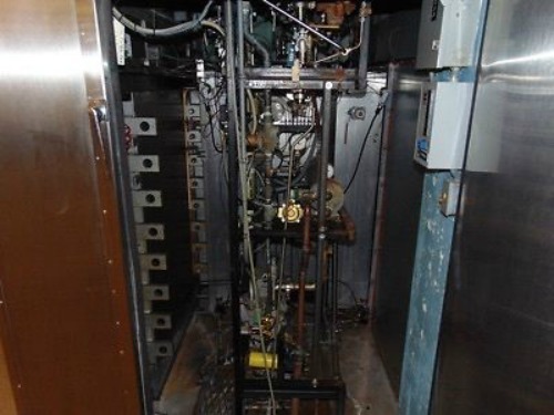 Getinge 6910 Autoclave with Pass Through Doors and 2 Stainless Steel Carts