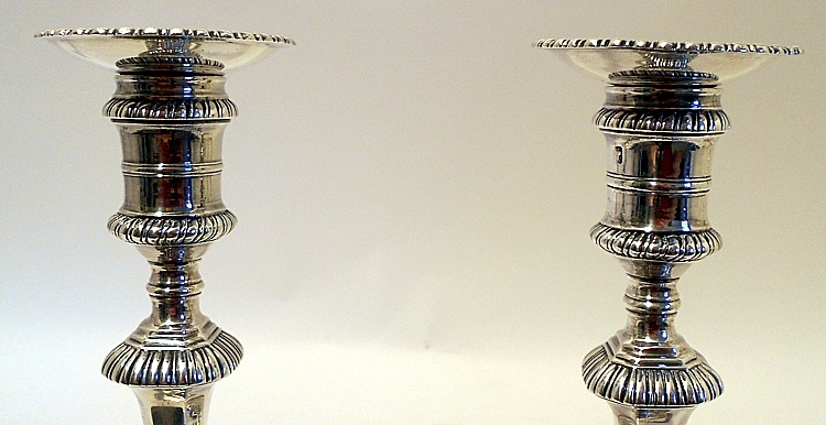 A good set of 4 cast sterling silver candlesticks, Ebenezer Coker, London 1762.