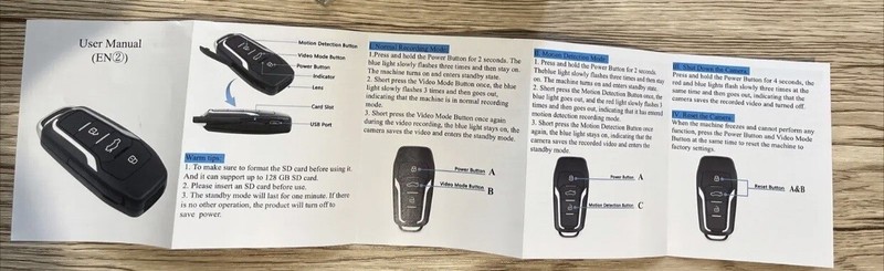 Car key fob user manual booklet on table.
