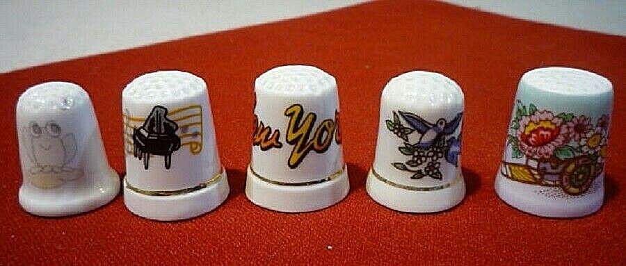 Ten vintage porcelain thimbles with designs. Collectible thimbles