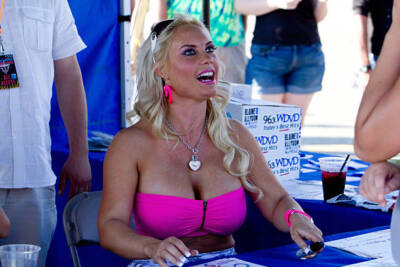 Coco attends the Motors and Music Experience in the parking lot of- Old Photo 1