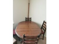 Extending dining table with 4 chairs (can deliver)