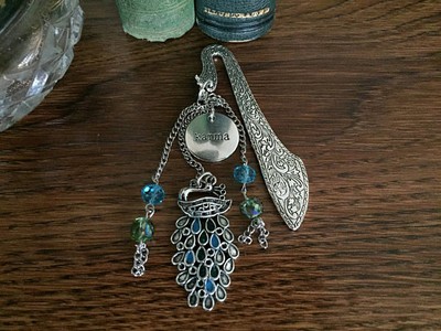 Karma is a Peacock on Ornate Silver Finish Bookmark with Blue & Green Swarovski