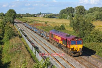 PHOTO  CLASS 66 NO 66053  AT BRANSTON MAIN LINE SOUTH OF BRANSTON. 2016